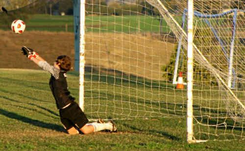 GOALKEEPER JACK GODLEY makes a vital save in the penalty shootout to win the match for the Gatton Redbacks. GOALKEEPER JACK GODLEY makes a vital save in the penalty shootout to win the match for the Gatton Redbacks.