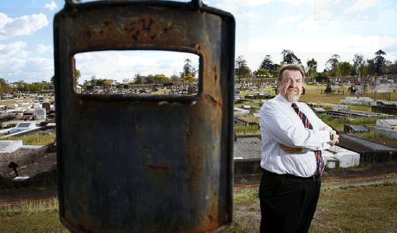 Cr Paul Tully standing at the site in the Ipswich cemetery where Dan Kelly, Ned’s brother, is thought to be buried. Cr Paul Tully standing at the site in the Ipswich cemetery where Dan Kelly, Ned’s brother, is thought to be buried.