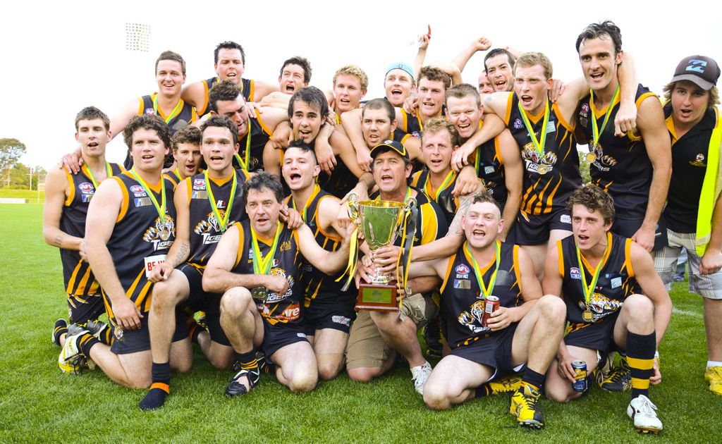 The victorious Grafton Tigers celebrate their grand final in the North Coast AFL competition with a 70-55 win over the Port Macquarie Magpies. Photo: NICKY FLETCHER The victorious Grafton Tigers celebrate their grand final in the North Coast AFL competition with a 70-55 win over the Port Macquarie Magpies. Photo: NICKY FLETCHER