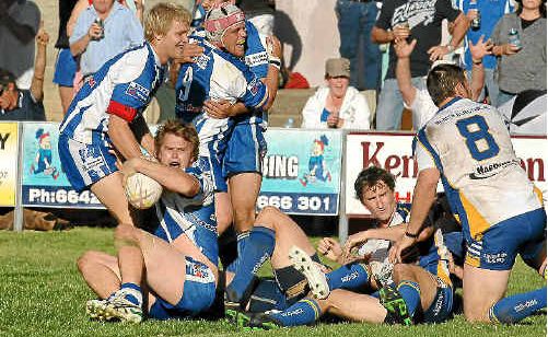 Grafton Ghosts Aaron Hartmann is congratulated after crossing for a try during yesterday’s grand final win over Murwillumbah. Grafton Ghosts Aaron Hartmann is congratulated after crossing for a try during yesterday’s grand final win over Murwillumbah.