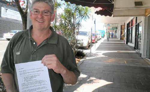 Robert Hall, holding his CV on Goondoon St, is doing everything he can to score a job in the resources sector. Robert Hall, holding his CV on Goondoon St, is doing everything he can to score a job in the resources sector.