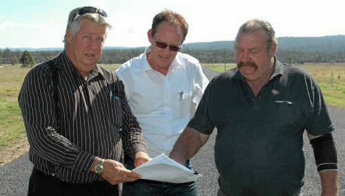 WAR ON WATER: Helidon developer Hans Nan (right) shows Lockyer MP Ian Rickuss (left) and Shadow Minister for Water and Utilities Steve Dickson a bill for water not being used at the new estate. WAR ON WATER: Helidon developer Hans Nan (right) shows Lockyer MP Ian Rickuss (left) and Shadow Minister for Water and Utilities Steve Dickson a bill for water not being used at the new estate.