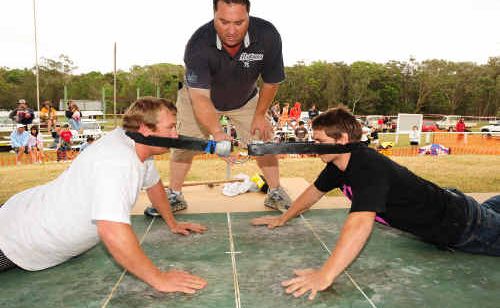 Lachlan Brooke of Tallebudgera takes on Joe Smith of Coffs Harbour under the watchful eye of judge Wayne Phillips at the Australian Goanna-Pulling Championships. Lachlan Brooke of Tallebudgera takes on Joe Smith of Coffs Harbour under the watchful eye of judge Wayne Phillips at the Australian Goanna-Pulling Championships.