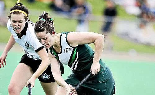 Glee player Cassie Hughes, right, and Northern Star’s Melinda Slade go for the ball in a Hepburn Park match last year.