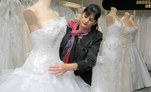Jill Burston for Brides designer and fitter Jocelyn Fairbairn shows off a Brides Desire Gossamer style dress with corded metallic laces and feathers and Swarovski crystals. A traditional white dress, accompanied by a veil, is still the top pick for brides-to-be. Jill Burston for Brides designer and fitter Jocelyn Fairbairn shows off a Brides Desire Gossamer style dress with corded metallic laces and feathers and Swarovski crystals. A traditional white dress, accompanied by a veil, is still the top pick for brides-to-be.