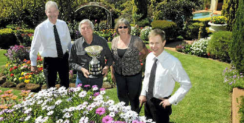Grand Champion garden winners Arch and Julie Roggeveen are presented with their trophy by Heritage Building Society CEO John Minz (left) and The Chronicle general manager Rohan Gosstray. Grand Champion garden winners Arch and Julie Roggeveen are presented with their trophy by Heritage Building Society CEO John Minz (left) and The Chronicle general manager Rohan Gosstray.