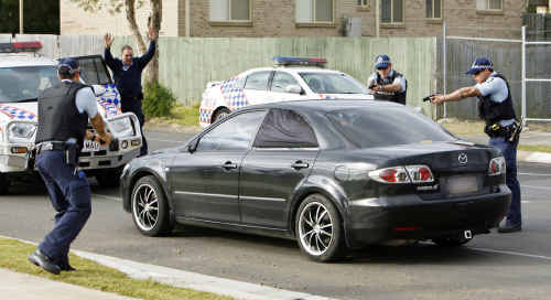 Police pounce on the vehicle of now-convicted armed offender Barry John Rea at Redbank Plains on June 2. Police pounce on the vehicle of now-convicted armed offender Barry John Rea at Redbank Plains on June 2.
