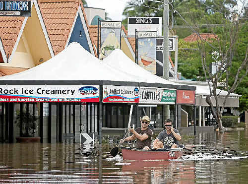 WET ONE: Brisbane, unlike the Coast, didn’t dodge the big wet bullet. Here, the main street of the inner western locality of Rosalie becomes a waterway.