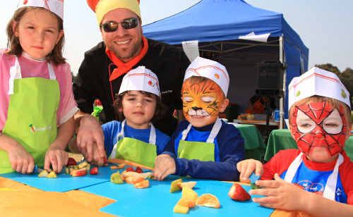 Elliesa Topping, Topaz Quarta, Harry and Charlie Williamson prepare a fruit salad using child-friendly knives. Elliesa Topping, Topaz Quarta, Harry and Charlie Williamson prepare a fruit salad using child-friendly knives.