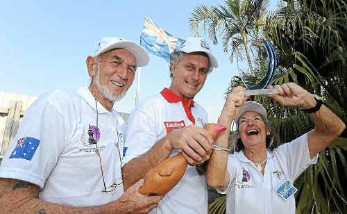 Peter Charles, Mark Clancy and Judy O’Donoghue celebrate receiving their replica trophy, T-shirts, hats and application for next year’s race. Peter Charles, Mark Clancy and Judy O’Donoghue celebrate receiving their replica trophy, T-shirts, hats and application for next year’s race.