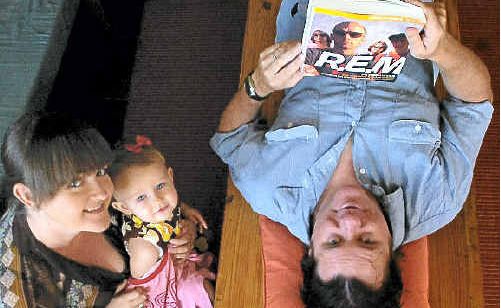 R.E.M. fan Bruce MacKenzie needs the support of family members Samantha Turnbull and Liberty MacKenzie, 18 months, after hearing the band has finally called it quits. R.E.M. fan Bruce MacKenzie needs the support of family members Samantha Turnbull and Liberty MacKenzie, 18 months, after hearing the band has finally called it quits.