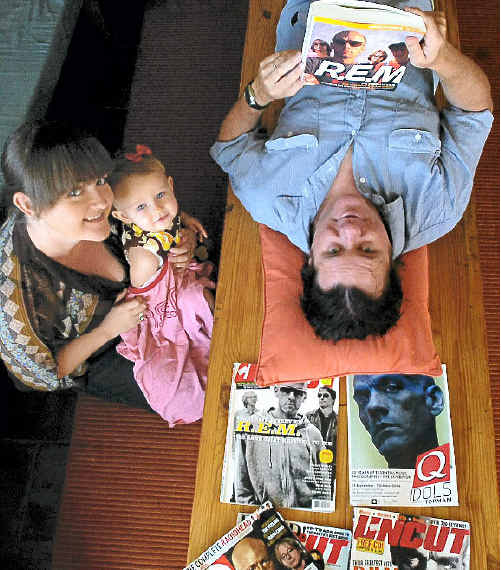 R.E.M. fan Bruce MacKenzie needs the support of family members Samantha Turnbull and Liberty MacKenzie, 18 months, after hearing the band has finally called it quits.