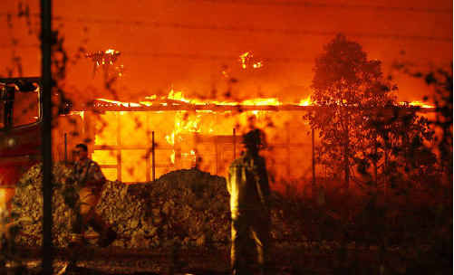 Fire engulfs buildings at the old North Ipswich Railway Workshops last night. Fire engulfs buildings at the old North Ipswich Railway Workshops last night.