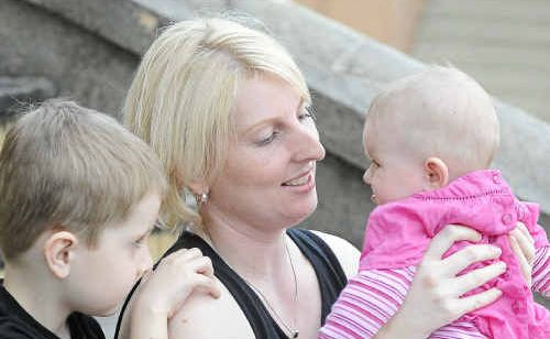 Childcare worker Lisa Cheal with Zac Pitt, 5, and Mia Mackay, 5 months, gathered with other workers to debate the industry crisis. Childcare worker Lisa Cheal with Zac Pitt, 5, and Mia Mackay, 5 months, gathered with other workers to debate the industry crisis.