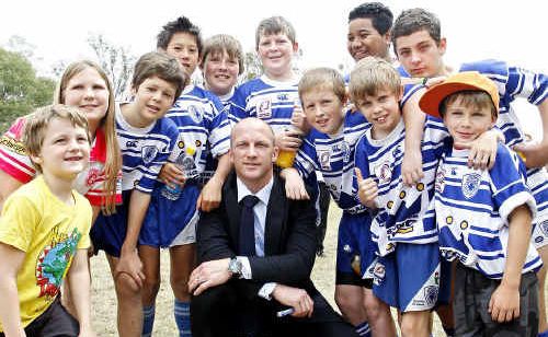 Broncos legend Darren Lockyer with the Brothers Junior Rugby League Football Club kids at Blacksoil where his name adorns the highway. Broncos legend Darren Lockyer with the Brothers Junior Rugby League Football Club kids at Blacksoil where his name adorns the highway.
