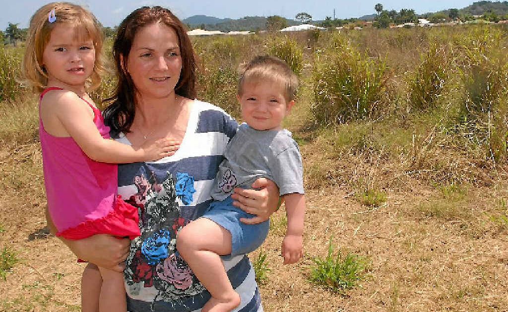 Tracey Rutledge is concerned about the safety of her children, including Rahni and Lachlan, because rats and snakes keep venturing into her garden from this overgrown lot. Tracey Rutledge is concerned about the safety of her children, including Rahni and Lachlan, because rats and snakes keep venturing into her garden from this overgrown lot.