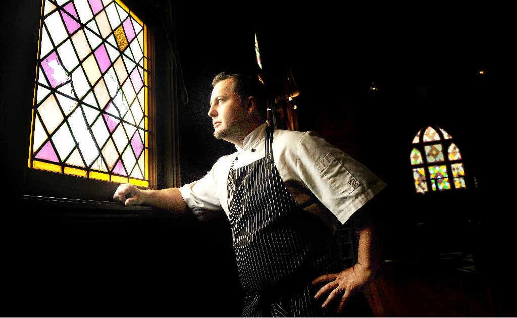 Peter Fleming, owner and chef of 561 Alphadale cafe restaurant pictured with one of the smashed stained glass windows. Peter Fleming, owner and chef of 561 Alphadale cafe restaurant pictured with one of the smashed stained glass windows.