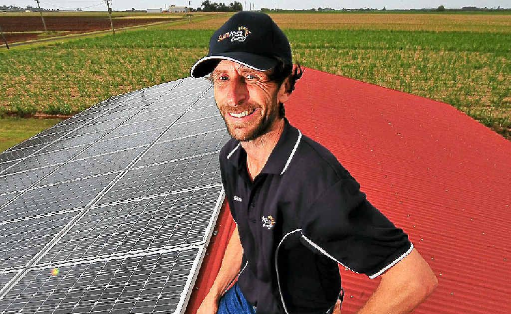 Simon De Bomford with one of the solar electricity systems he has installed around the region. Simon De Bomford with one of the solar electricity systems he has installed around the region.
