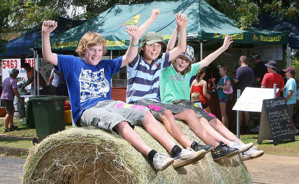 Thomas Yarrow, Steven Miller and Windston Olive perch precariously on one of the many bales of hay decorating Kalbar town on the weekend. Thomas Yarrow, Steven Miller and Windston Olive perch precariously on one of the many bales of hay decorating Kalbar town on the weekend.