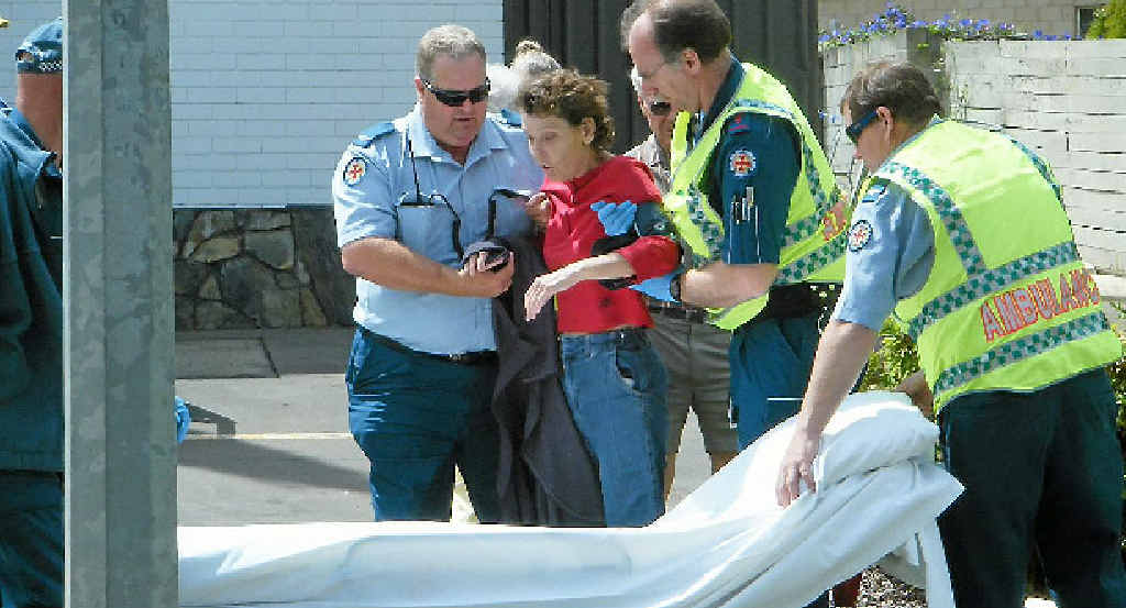 Rosemary Borg, who was a passenger in the ute, is assisted by paramedics after suffering an epileptic seizure. Rosemary Borg, who was a passenger in the ute, is assisted by paramedics after suffering an epileptic seizure.