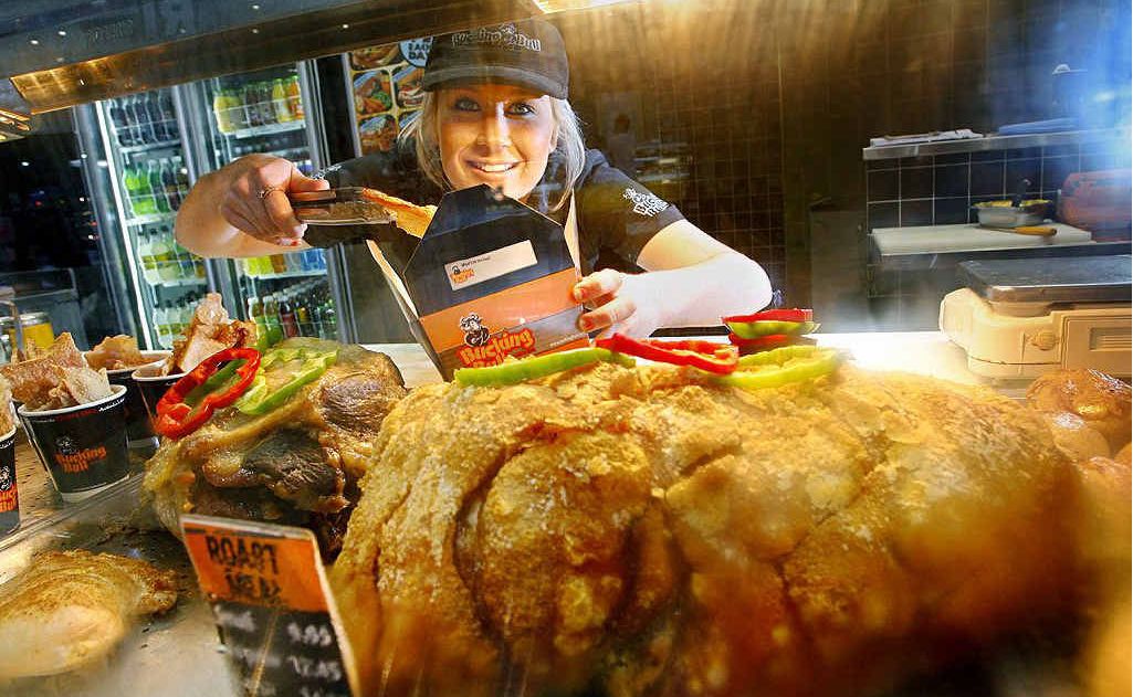 Ashleigh Parfitt serves up some pork crackling at the Bucking Bull carvery at Riverlink Shopping Centre. Bucking Bull has stopped stocking roast lamb in its carvery due to increased meat prices. Ashleigh Parfitt serves up some pork crackling at the Bucking Bull carvery at Riverlink Shopping Centre. Bucking Bull has stopped stocking roast lamb in its carvery due to increased meat prices.