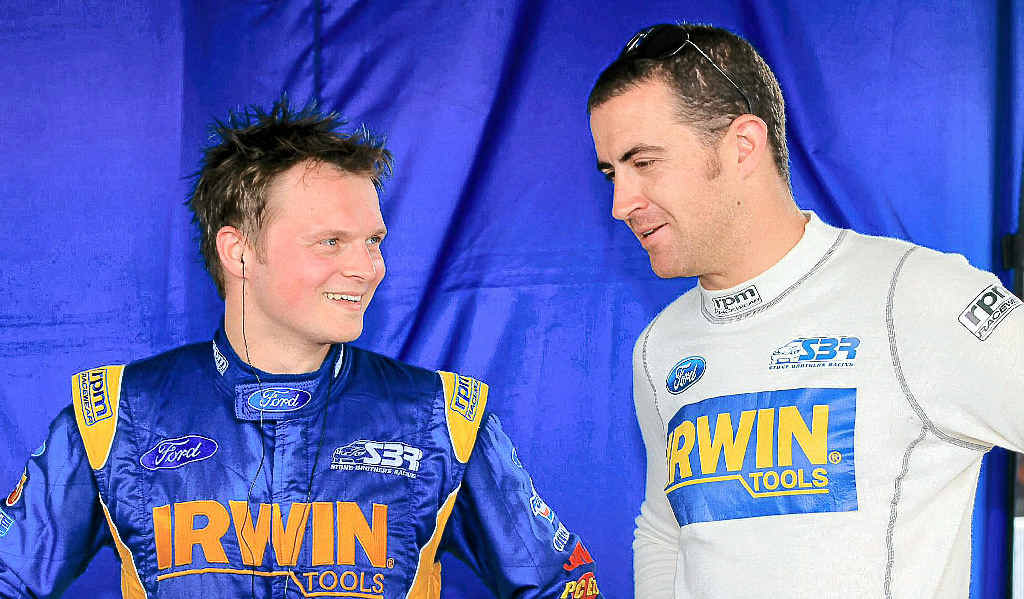 German driver Marc Lieb talks to his Gold Coast 600 co-driver Alex Davidson during practice yesterday at the Queensland Raceway. German driver Marc Lieb talks to his Gold Coast 600 co-driver Alex Davidson during practice yesterday at the Queensland Raceway.