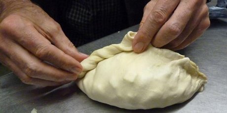 Jim Eagles puts the finishing touch to a Cornish pasty at the Chough Bakery at Padstow. Jim Eagles puts the finishing touch to a Cornish pasty at the Chough Bakery at Padstow.
