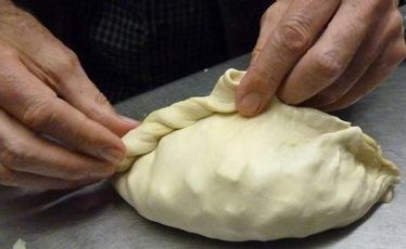 Jim Eagles puts the finishing touch to a Cornish pasty at the Chough Bakery at Padstow. Jim Eagles puts the finishing touch to a Cornish pasty at the Chough Bakery at Padstow.