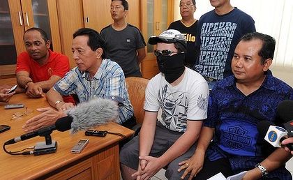Boy in the mask ... the teenager charged with drug offences in Bali attends a press conference after moving jails yesterday. Photo: Hansel Nashyo
Boy in the mask ... the teenager charged with drug offences in Bali attends a press conference after moving jails yesterday. Photo: Hansel Nashyo