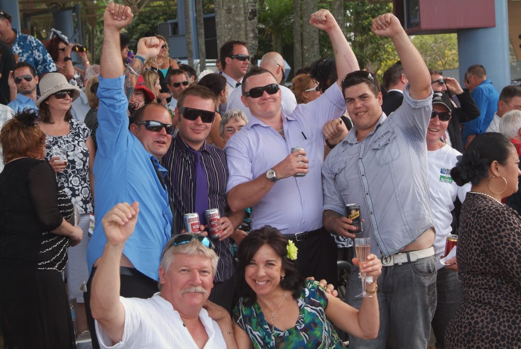 Corbould Park Racecourse, Caloundra. Racegoers watch the Melbourne Cup on the big screen.