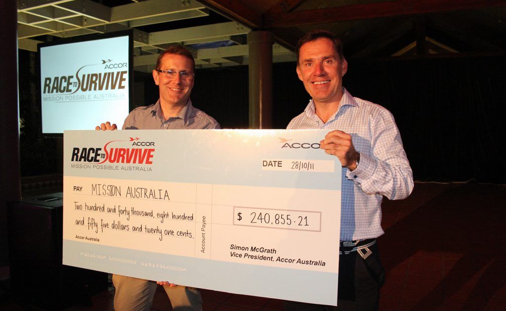 Accor Australia vice president, Simon McGrath proudly presents a cheque to Mission Australia CEO Toby Hall. Accor Australia vice president, Simon McGrath proudly presents a cheque to Mission Australia CEO Toby Hall.