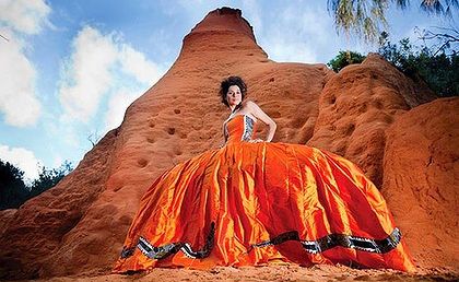 Juliette Knox wearing her Uluru dress, 2010. Designer: Yaneira Velasquez. Snake design by Peter Muraay Djeripi Mulcahy, applied by Sasa Mendoza.
Juliette Knox wearing her Uluru dress, 2010. Designer: Yaneira Velasquez. Snake design by Peter Muraay Djeripi Mulcahy, applied by Sasa Mendoza.