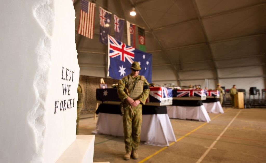 Catafalque Party rests on arms during the memorial service. Australian soldiers and their Afghan coalition partners pay their final respects to their fallen comrades Corporal Ashley Birt, Captain Bryce Duffy and Lance Corporal Luke Gavin at Tarin Kot. Catafalque Party rests on arms during the memorial service. Australian soldiers and their Afghan coalition partners pay their final respects to their fallen comrades Corporal Ashley Birt, Captain Bryce Duffy and Lance Corporal Luke Gavin at Tarin Kot.