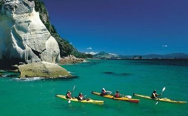 Sea kayakers at Cathedral Cove. Sea kayakers at Cathedral Cove.
