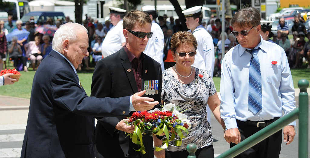 Bob Stretton helps Dale, Linda and Don Birt lay a wreath for the fallen. Bob Stretton helps Dale, Linda and Don Birt lay a wreath for the fallen.
