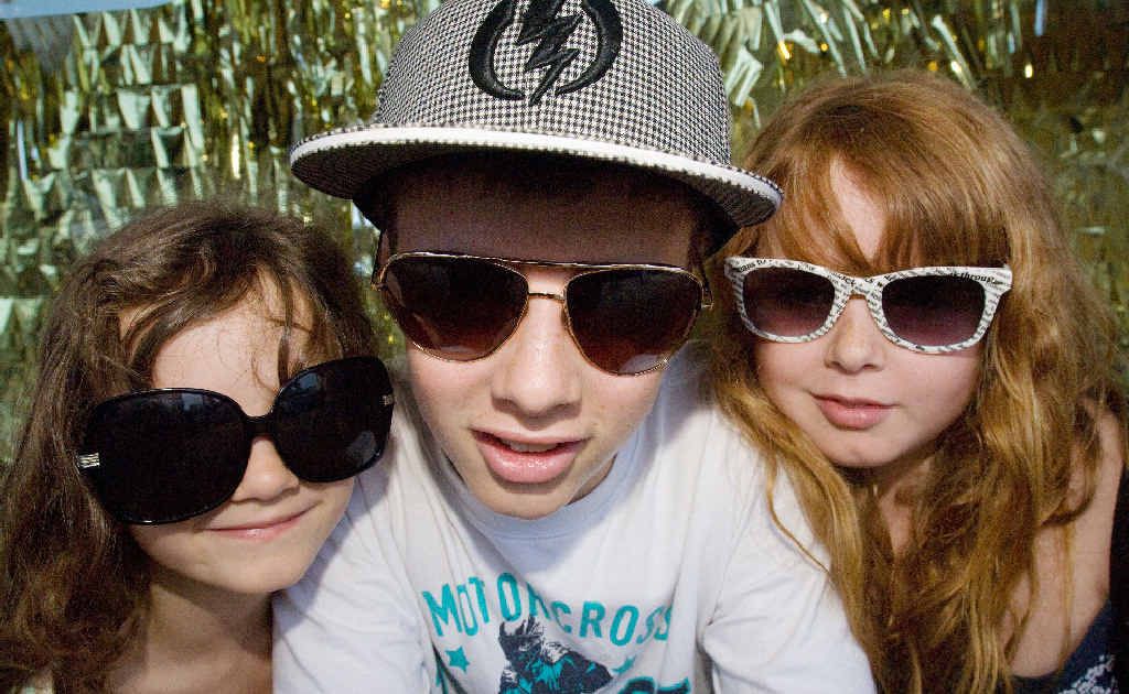 Manyana, 6, Josh, 13, and Jame’ah, 10, Ost of Corowa show off their fashionable sunglasses in Byron Bay. Manyana, 6, Josh, 13, and Jame’ah, 10, Ost of Corowa show off their fashionable sunglasses in Byron Bay.