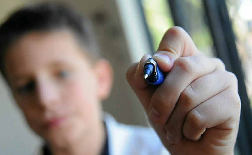 Layne Bennet-Wood, 11, writes with his left hand and has found some special pens and pencils to help him write better. Layne Bennet-Wood, 11, writes with his left hand and has found some special pens and pencils to help him write better.