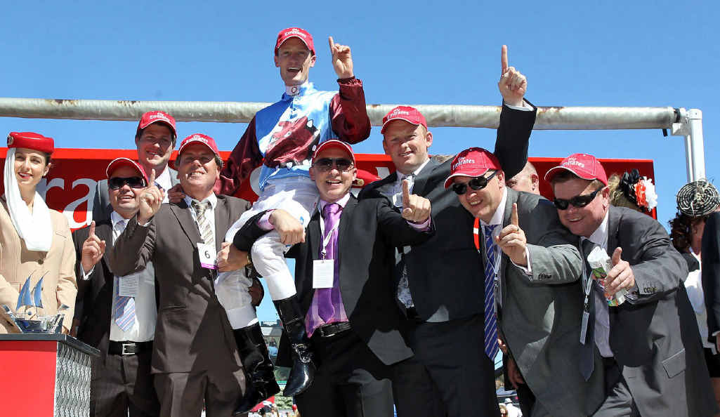 Albert the Fat’s Ipswich owners celebrate their horse’s win in the Group 1 Emirates Stakes at Flemington. Albert the Fat’s Ipswich owners celebrate their horse’s win in the Group 1 Emirates Stakes at Flemington.