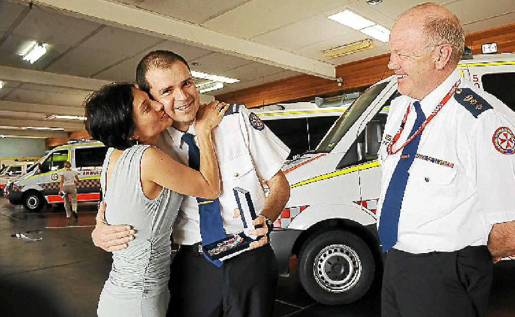 10-year service medal recipient Gonzalo De Angulo-Aponte gets a kiss from his wife Juliana De Angulo as deputy director of operations North Coast chief superintendent Peter Pilon looks on. 10-year service medal recipient Gonzalo De Angulo-Aponte gets a kiss from his wife Juliana De Angulo as deputy director of operations North Coast chief superintendent Peter Pilon looks on.