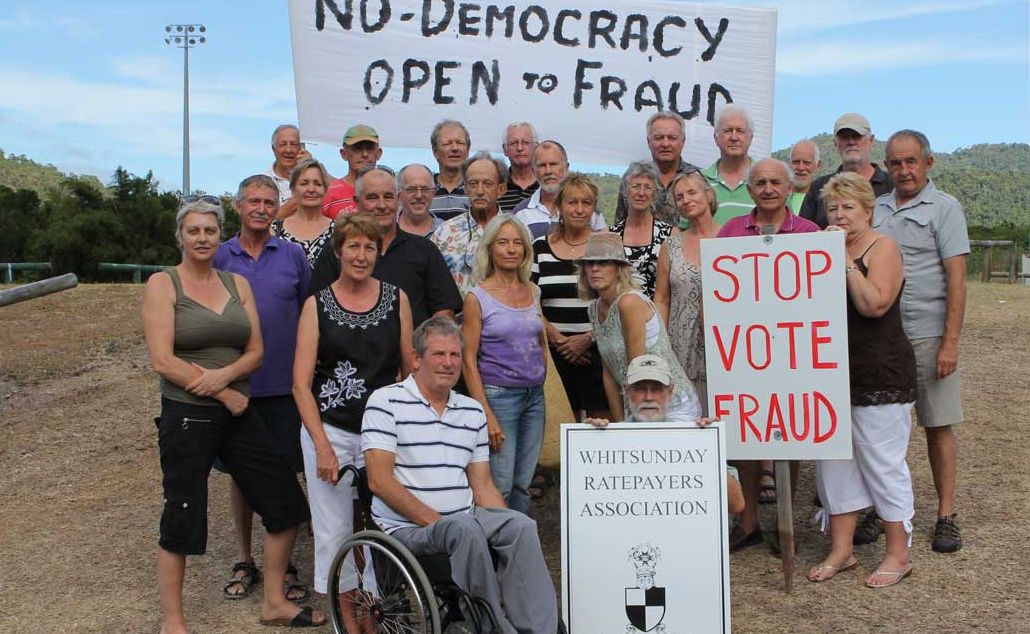 PROTESTING: Whitsunday residents are protesting against a purely postal vote system in the Whitsundays. Back: John Hill, Cliff Hansen, Peter Harvey, Adrian Abrahams, Lester Riley, David Howells, David Brooks and Rory McCourt. Middle: Claire Anspach, Jonathan Peter, Sue Harvey, Olga Dufty, Malcom Anspach, Ross Plowman, Richard Altmann, Joey Prowse, Andrew Marshall, Helen Altmann, Leonie Lovell, Heather Marshall, Susan Lilley, Tony Moscato, Connie Riley and Dive Tindall. Front: Alan Dufty and Peter Jennings. Photo Sharon Smallwood / Whitsunday Times PROTESTING: Whitsunday residents are protesting against a purely postal vote system in the Whitsundays. Back: John Hill, Cliff Hansen, Peter Harvey, Adrian Abrahams, Lester Riley, David Howells, David Brooks and Rory McCourt. Middle: Claire Anspach, Jonathan Peter, Sue Harvey, Olga Dufty, Malcom Anspach, Ross Plowman, Richard Altmann, Joey Prowse, Andrew Marshall, Helen Altmann, Leonie Lovell, Heather Marshall, Susan Lilley, Tony Moscato, Connie Riley and Dive Tindall. Front: Alan Dufty and Peter Jennings. Photo Sharon Smallwood / Whitsunday Times