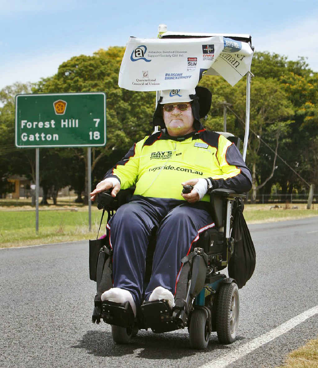 Ray Colbert is driving his electric wheelchair from Toowoomba to Brisbane for asbestos awareness. Ray Colbert is driving his electric wheelchair from Toowoomba to Brisbane for asbestos awareness.