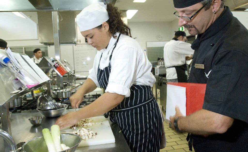 Judge and executive chef of the Ballina RSL and Bowling Club, Gerhard Spatz, overlooks Wollongbar apprentice chef Nadia de Jong as she competes in the WorldSkills Cookery Competition. Judge and executive chef of the Ballina RSL and Bowling Club, Gerhard Spatz, overlooks Wollongbar apprentice chef Nadia de Jong as she competes in the WorldSkills Cookery Competition.