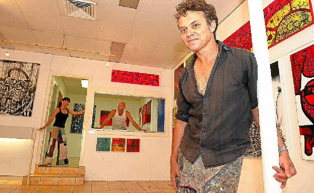 Eltham artist Jay Manby in the Magellan St art space in Lismore. In the background are friends Anna Mackney and Dave Barkas. Eltham artist Jay Manby in the Magellan St art space in Lismore. In the background are friends Anna Mackney and Dave Barkas.