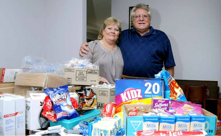 Jenni and Rob Eising collect items for care packs to send to Australian soldiers serving in Afghanistan.