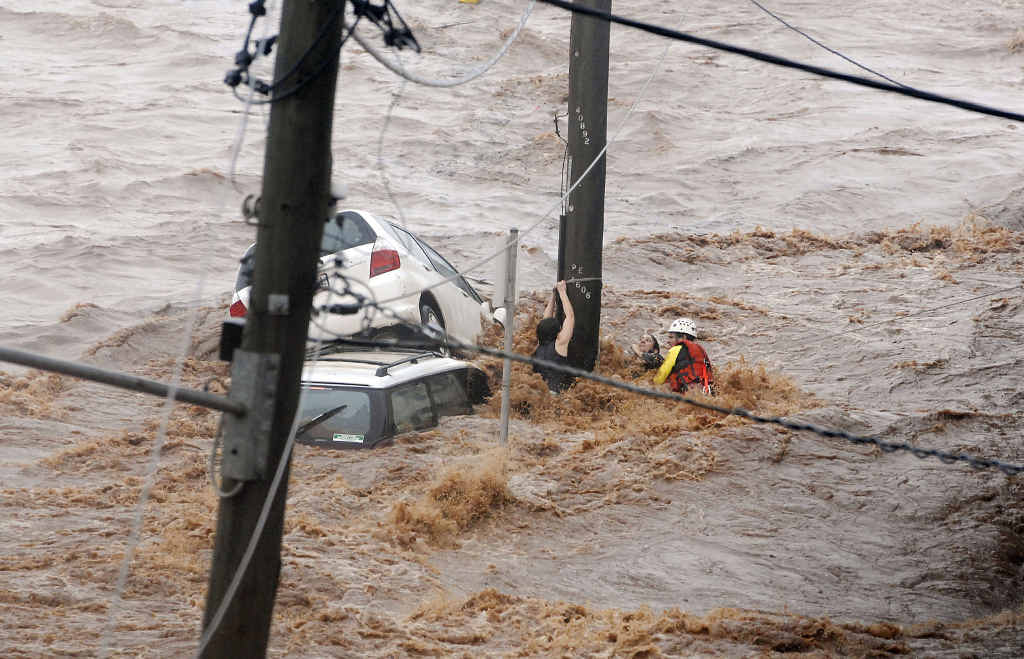 Chronicle photographer Neville Madsen captured this gripping moment in his Walkley Award-winning photograph of a flood rescue. Chronicle photographer Neville Madsen captured this gripping moment in his Walkley Award-winning photograph of a flood rescue.