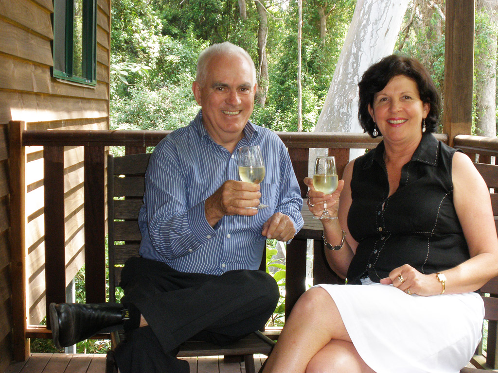 Greg Johnson and Chamber Board Member Nancy Sommerfield relaxing with a 2011 Preston Peak Verdelho at Ravensbourne Forest Chalets.