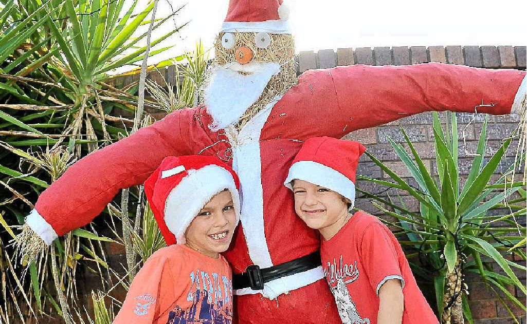 Robbie Warren, 8 and his brother Jamie, 6 have built a scarecrow in their front yard. Robbie Warren, 8 and his brother Jamie, 6 have built a scarecrow in their front yard.