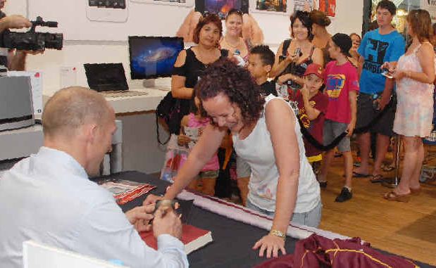 Crystal Edwards, of Mackay, hits the front of the long queue for rugby league legend Darren Lockyer’s autograph at new Apple outlet, Next Byte. Crystal Edwards, of Mackay, hits the front of the long queue for rugby league legend Darren Lockyer’s autograph at new Apple outlet, Next Byte.