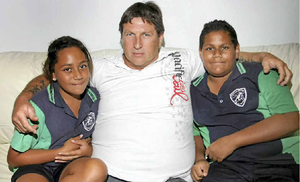 Mark White with his children Matthew, 12, and Emily, 11, is suing Queensland Health over the death of his wife, Alana. Mark White with his children Matthew, 12, and Emily, 11, is suing Queensland Health over the death of his wife, Alana.
