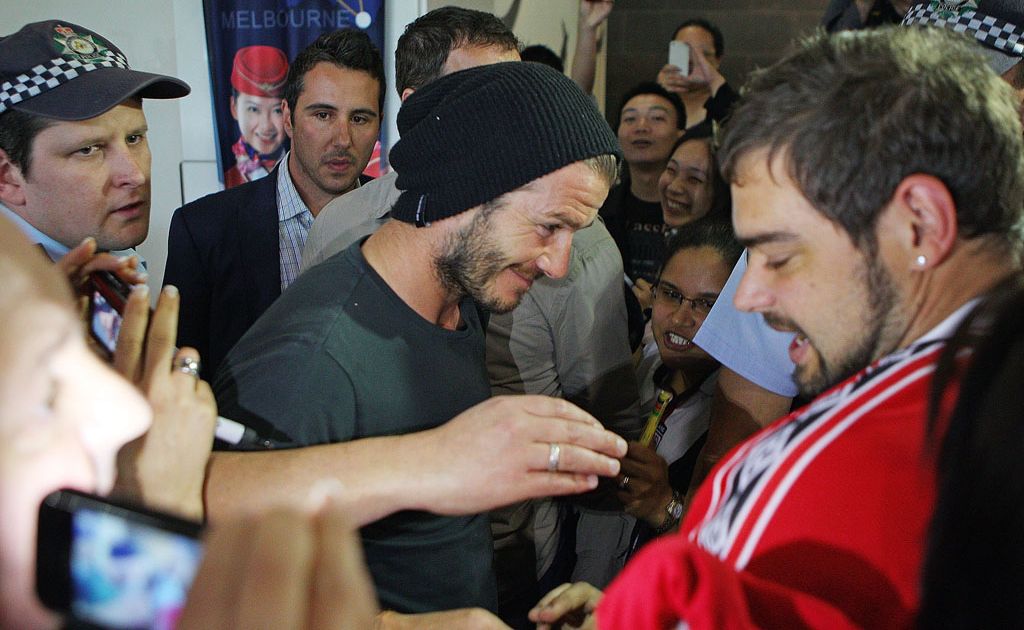 David Beckham was mobbed when he touched down at Melbourne's Tullamarine Airport. David Beckham was mobbed when he touched down at Melbourne's Tullamarine Airport.